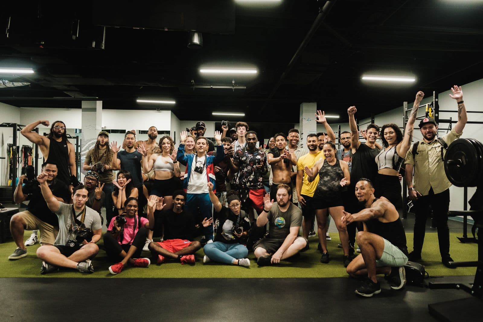 A diverse fitness community celebrating together after training